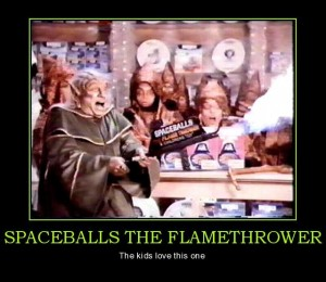 Demotivational-poster meme: a still of Mel Brooks as Yogurt in Spaceballs holding a Spaceballs flamethrower, captioned “SPACEBALLS THE FLAMETHROWER — The kids love this one”