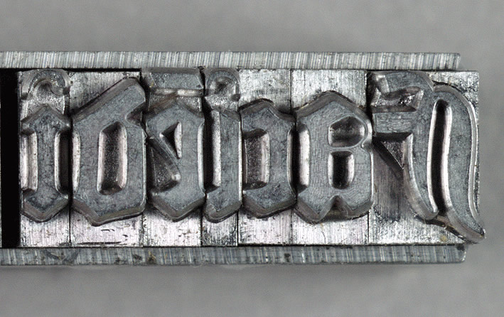 Movable type set in a forme, ready to be pressed
